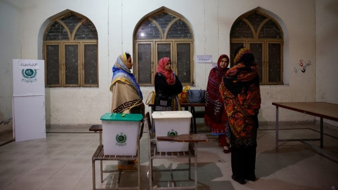 Staff are briefed inside a polling station on the day of the general election, in Lahore, Pakistan February 8, 2024 | Reuters