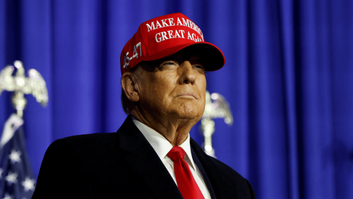 Former U.S. President Donald Trump looks on at a campaign event in Waterford Township, Michigan, U.S., February 17, 2024 | Rebecca Cook | Reuters