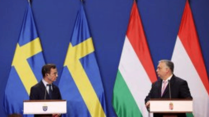 Swedish Prime Minister Ulf Kristersson and Hungarian Prime Minister Viktor Orban hold a joint press conference in Budapest, Hungary, February 23, 2024 | Bernadett Szabo | Reuters