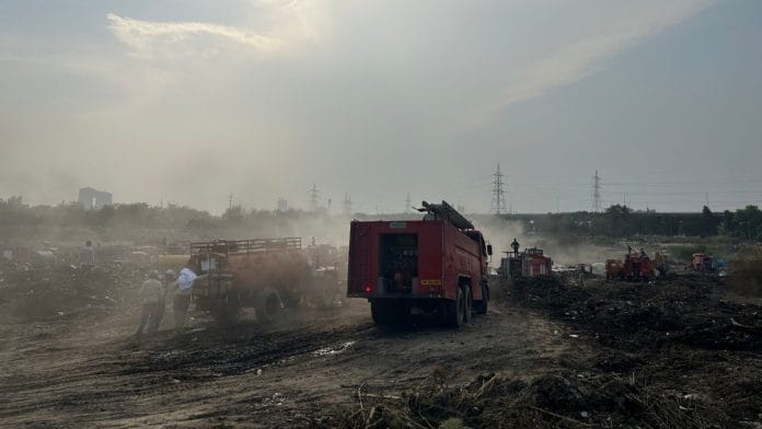Efforts to separate burning waste continue at Sector 32 Noida dumping yard, which caught fire on Holi | Zenaira Bakhsh | ThePrint