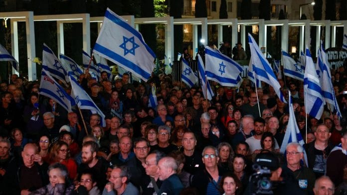 People attend a demonstration calling for the return of hostages held in Gaza since October 7 and against Israeli PM Benjamin Netanyahu's coalition government, demanding an end to the exemption of ultra-Orthodox Jewish men from compulsory military service, in Tel Aviv, Israel March 14, 2024 | Reuters/Carlos Garcia Rawlins