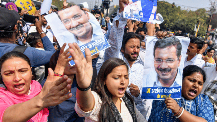 Aam Aadmi Party (AAP) supporters protest against the arrest of Delhi CM and AAP convenor Arvind Kejriwal at ITO in New Delhi | ANI