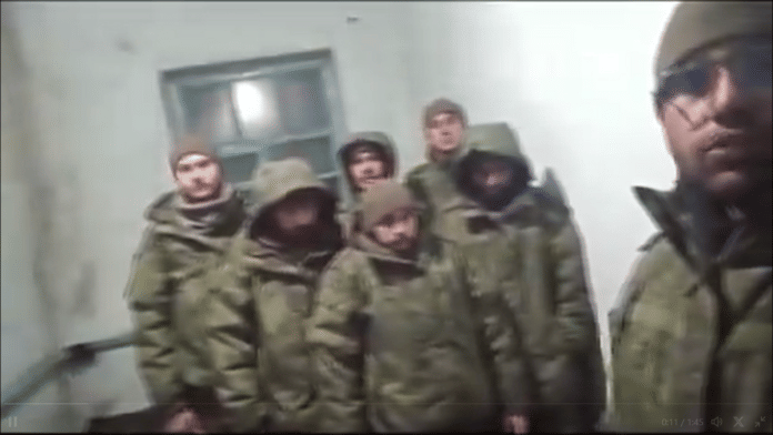 A screen shot from a viral video of the seven men who claim they were tricked into joining the battle front | Credit: X