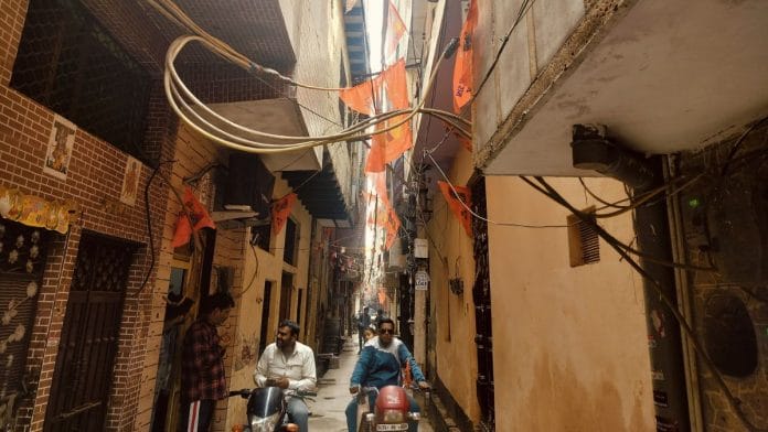 'Jai Shri Ram' flags plastered all over the narrow Gully no. 1 in Seelampur | Photo: Shubhangi Misra | ThePrint