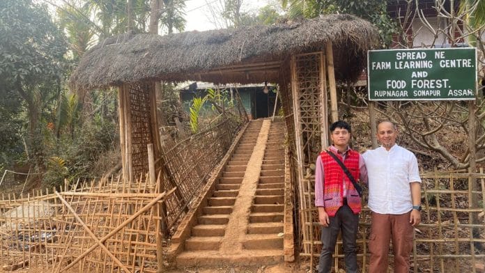 Farmer Samir Bordoloi (right) and green commando Krishna Chakma outside the Food Forest and Farm Learning Centre in Rupnagar, Sonapur, Assam | Gitanjali Das | ThePrint