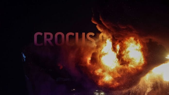 View of the burning Crocus City Hall concert venue following a shooting incident, outside Moscow, Russia | Reuters