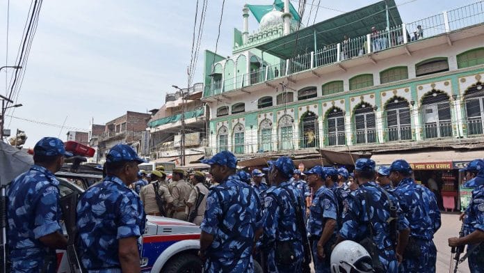 Rapid Action Force and police personnel stand guard in Prayagraj following the death of gangster-turned-politician Mukhtar Ansari on Friday. | ANI