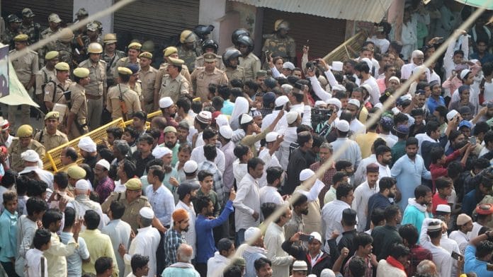 Locals gather outside the residence of the gangster-turned-politician Mukhtar Ansari before the arrival of his mortal remains at Mohammadabad, in Ghazipur district, Saturday, March 30, 2024 | PTI