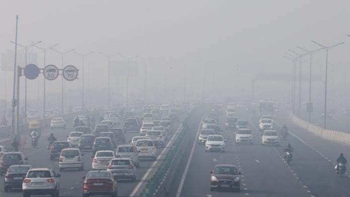 Traffic moves along a highway shrouded in heavy smog in New Delhi, India, December 26, 2023 | Reuters file photo