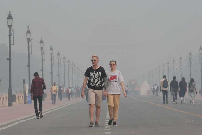Foreigners stroll in Delhi, surrounded by the haze of pollution | File photo | Photo: Suraj Singh Bisht | ThePrint