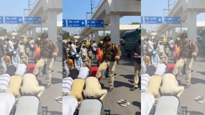 Screengrab from viral video of Delhi policeman kicking people offering namaz in Delhi's Inderlok area | Source: X