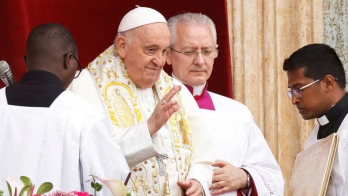 Pope Francis gestures from a balcony at St. Peter's Square, on Easter Sunday, at the Vatican March 31, 2024. REUTERS/Remo Casilli/File Photo
