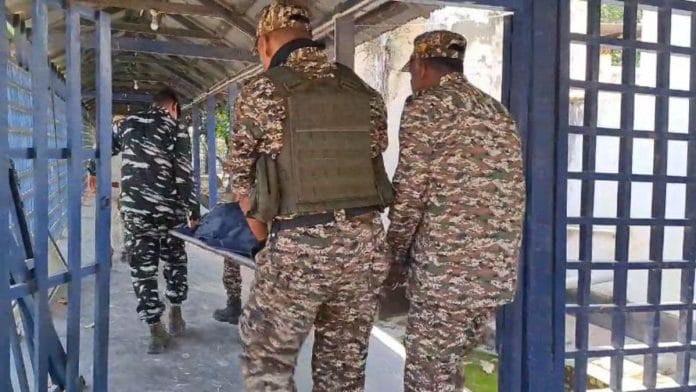 CRPF personnel taking the deceased to the mortuary at RIMS hospital, Imphal | By special arrangement