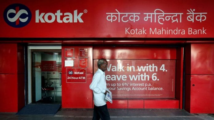 A man walks past Kotak Mahindra Bank branch in New Delhi | Photo: REUTERS/Adnan Abidi
