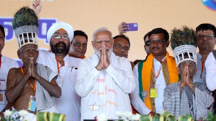 Prime Minister Narendra Modi with tribals and others during a public rally ahead of the Lok Sabha elections, in Mahasamund, Chhattisgarh on Tuesday, 23 April, 2024 | ANI