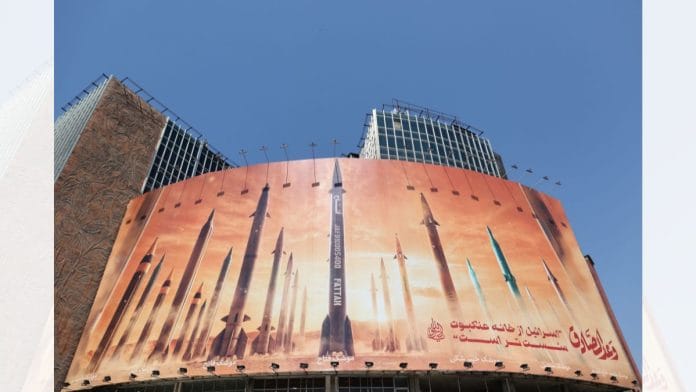 An anti-Israel billboard with a picture of Iranian missiles is seen on a street in Tehran | Rasoul Shojaie/IRNA/WANA via Reuters