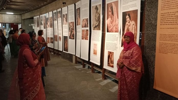 Onlookers get clicked in front of the panels at the Pathbreakers 2.0 exhibition in Delhi | Photo: Tina Das, ThePrint