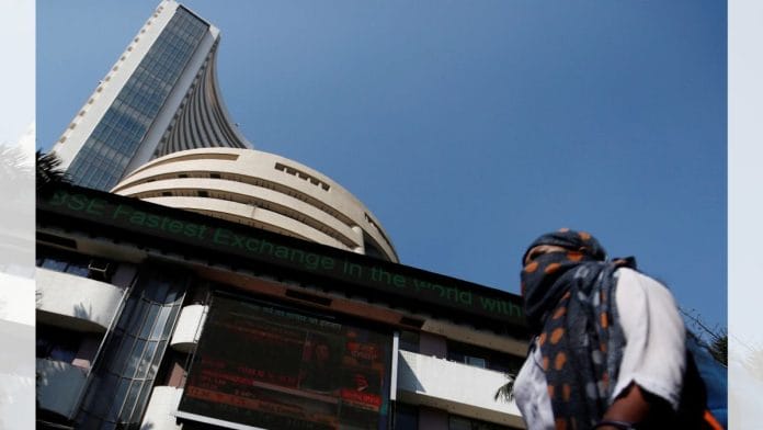 A woman walks past the Bombay Stock Exchange | File photo | Francis Mascarenhas/Reuters