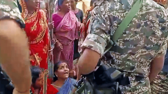 File photo of protesters allegedly trying to stop an NIA team from taking the accused in Bhupatinagar | ANI