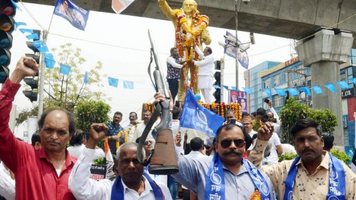 Followers of BR Ambedkar raise slogans after paying tribute to his statue on Ambedkar Jayanti in Bhopal | ANI