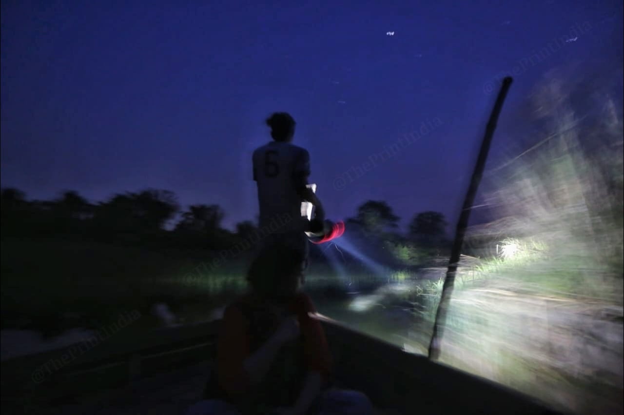 The boat traversing through the treacherous crocodile-infested waters of the Girwa river at night. This route connects Bharthapur to India | Photo: Praveen Jain | ThePrint