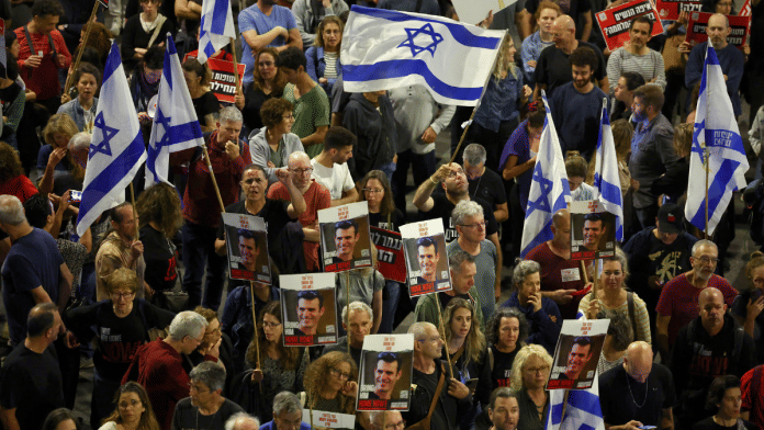 File Photo | People attend a protest against Israeli Prime Minister Benjamin Netanyahu's government and to call for the release of hostages kidnapped in the deadly 7 October attack on Israel by Hamas from Gaza, in Tel Aviv, Israel, 20 April 2024 | Reuters/Hannah McKay