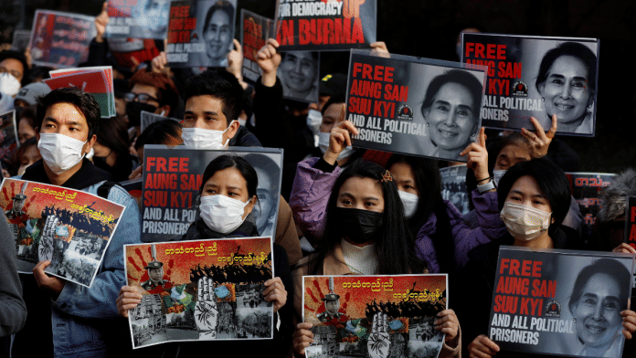 Representational image of Myanmar protesters residing in Japan raising photos of Aung San Suu Kyi during a rally to mark the 2nd anniversary of Myanmar's 2021 military coup, outside the Embassy of Myanmar in Tokyo, Japan February 1, 2023 | Reuters/Issei Kato