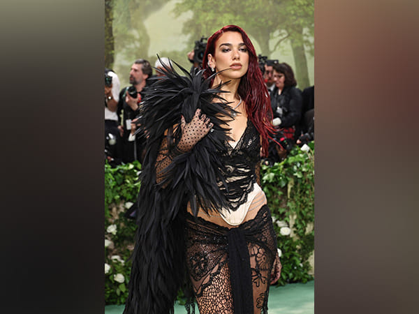 Met Gala: Dua Lipa strikes a pose in black lace gown
