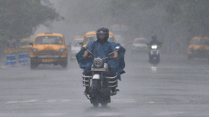Commuters on a road in Kolkata amid rain as Cyclone Remal approaches, Sunday | ANI
