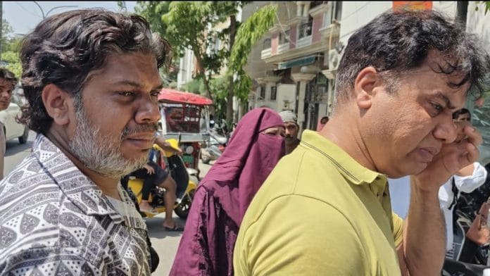 Anjar (left), whose 12-day-old daughter died in the fire, with his brother Nazim | Photo: Mayank Kumar, ThePrint