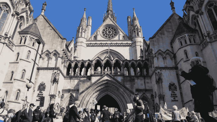 People attend a protest outside the High Court on the day of an extradition hearing of WikiLeaks founder Julian Assange, in London, Britain, 20 May, 2024 | Representational image | Credit: Reuters