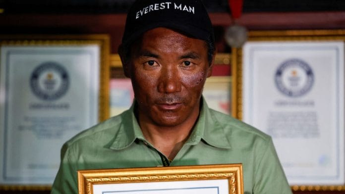 Kami Rita Sherpa, 53, a Nepali Mountaineer who climbed Mount Everest for a record 28 times, is pictured on the summit of Mount Everest during his 28th summit in Everest, May 23, 2023. Kami Rita Sherpa/Handout via REUTERS/ File Photo