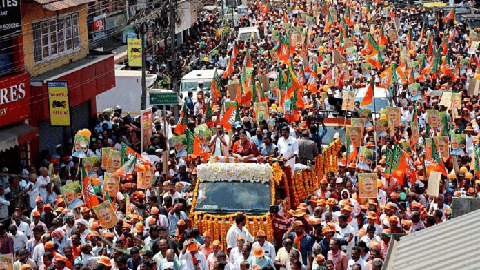 Kerala BJP chief and candidate from Wayanad, K Surendran with Union minister Smriti Irani during a roadshow in Wayanad | ANI