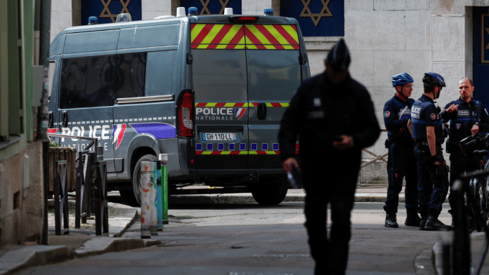 Police officers work after police shot dead an armed man earlier who set fire to the city's synagogue in Rouen, France | Reuters | Gonzalo Fuentes