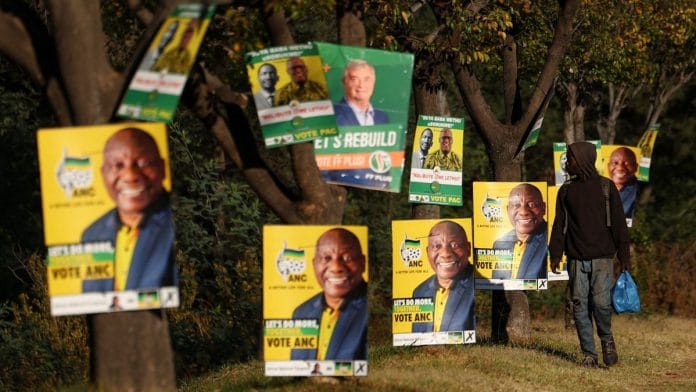 A man walks past election posters of the ruling African National Congress as South Africa prepares for the May 29 general elections, in Soweto, South Africa | Reuters/Siphiwe Sibeko