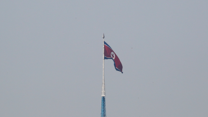 A North Korean flag flutters on top of the 160-metre tall tower at North Korea's propaganda village of Gijungdong | Reuters/Kim Hong-Ji