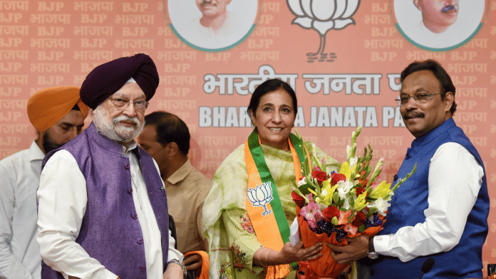 Union minister Hardeep Singh Puri and BJP general secretary Vinod Tawde welcome former IAS officer Parampal Kaur Sidhu after she joined BJP | ANI