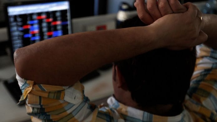A broker reacts while trading at his computer terminal at a stock brokerage firm in Mumbai, India, February 1, 2020 | File photo | Reuters | Francis Mascarenhas