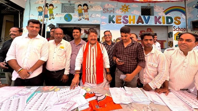 Vijayvargiya with booth workers