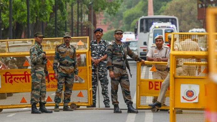Security personnel stand guard during a mock drill, near the Parliament building, in New Delhi, Friday, May 3, 2024 | PTI