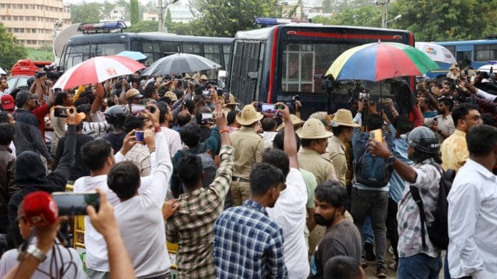 People outside a police station in Bengaluru after Kannada actor Darshan Thoogudeepa's arrest on 12 June, 2024 | ANI