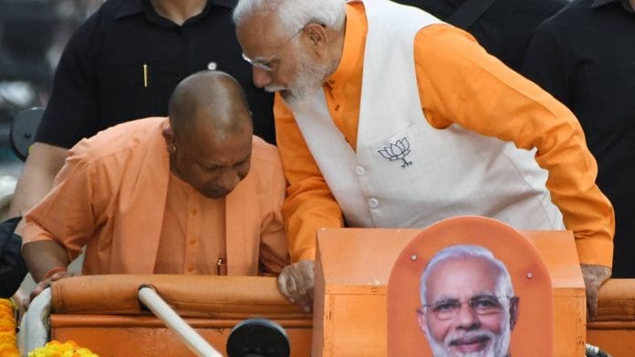 Prime Minister Narendra Modi (right) with Uttar Pradesh Chief Minister Yogi Adityanath at a roadshow in Varanasi last month | Photo: ANI