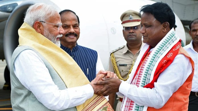 Prime Minister Narendra Modi being welcomed by Odisha Chief Minister-designate Mohan Charan Majhi on his arrival, at Biju Patnaik International Airport, in Bhubaneswar on Wednesday | ANI Photo