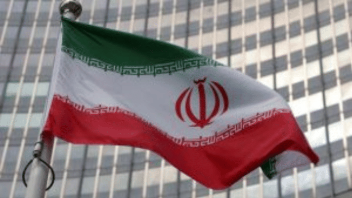 The Iranian flag flutters in front of the International Atomic Energy Agency (IAEA) organisation's headquarters in Vienna, Austria | Reuters/File Photo