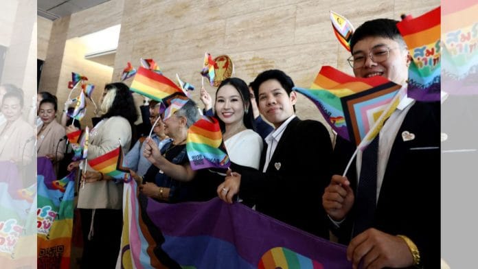 Members of the LGBTQ+ community react as they arrive ahead of the passing of the marriage equality bill | Reuters/Chalinee Thirasupa
