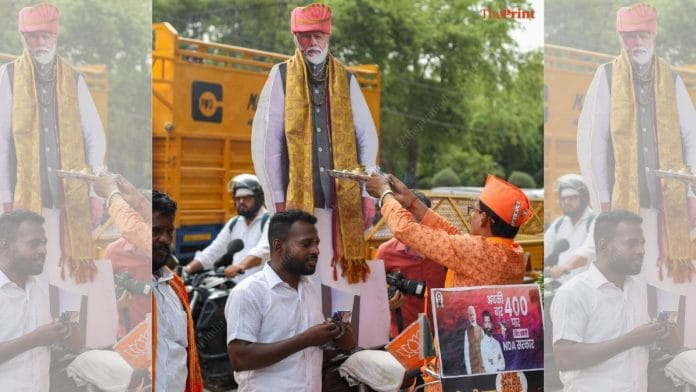 Party supporters celebrating outside BJP headquarters in Delhi on Tuesday | Suraj Singh Bisht | ThePrint