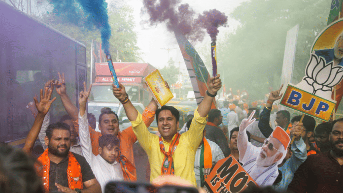 BJP workers celebrate outside party HQ in New Delhi, Tuesday | Suraj Singh Bisht | ThePrint