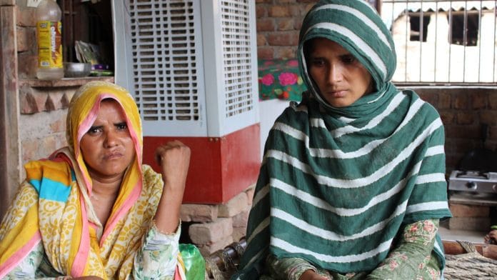 Parmeena (left) and Sajida (right), whose husbands were killed by cow vigilantes in Haryana, console and share their pain with each other, finding solace in their friendship amidst societal neglect | Photo | Heena Fatima | ThePrint