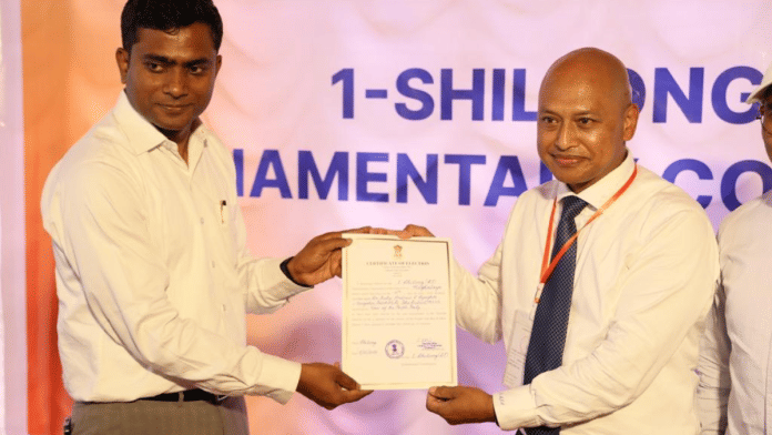 Returning Officer SC Sadhu hands over certificate to winning candidate Ricky AJ Syngkon from Voice of People Party in Shillong | PIB