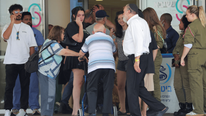 Supporters and family members of hostages, who were kidnapped during the deadly 7 October attack by Hamas, react as they walk towards a medical center after the military said that Israeli forces have rescued four hostages alive from the central Gaza Strip on Saturday, in Ramat Gan, Israel 8 June, 2024 | Reuters/Marko Djurica